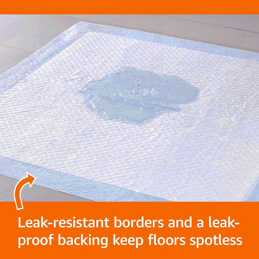 Close-up of the 5-layer absorbent technology on blue and white dog training pads.